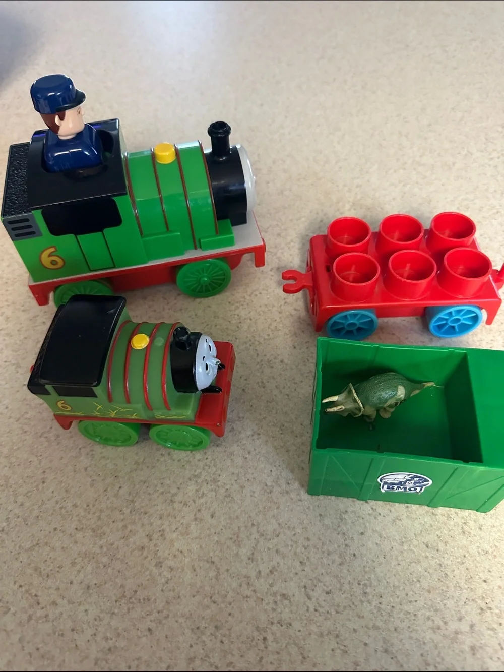 Green Percy the Small Engine toys and cargo cars from Thomas & Friends.